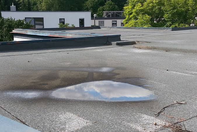How to Know When It’s Time to Replace Your Commercial Flat Roof: A Symptom-Based Diagnostic Guide
